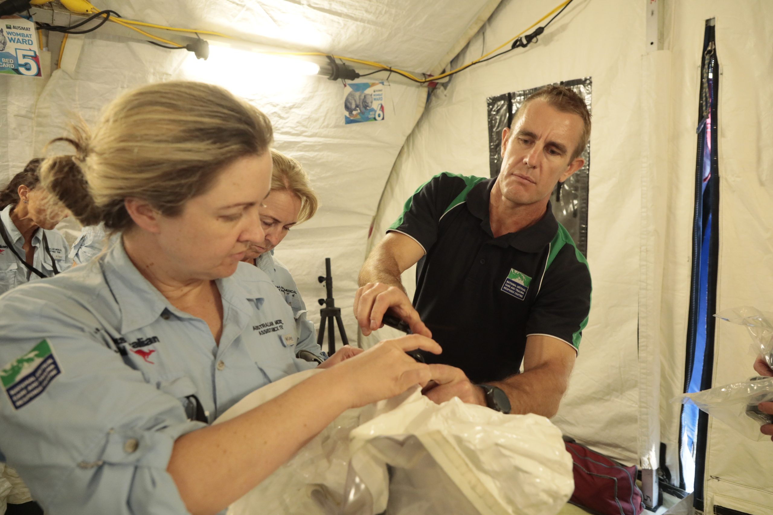 People in a white tent.