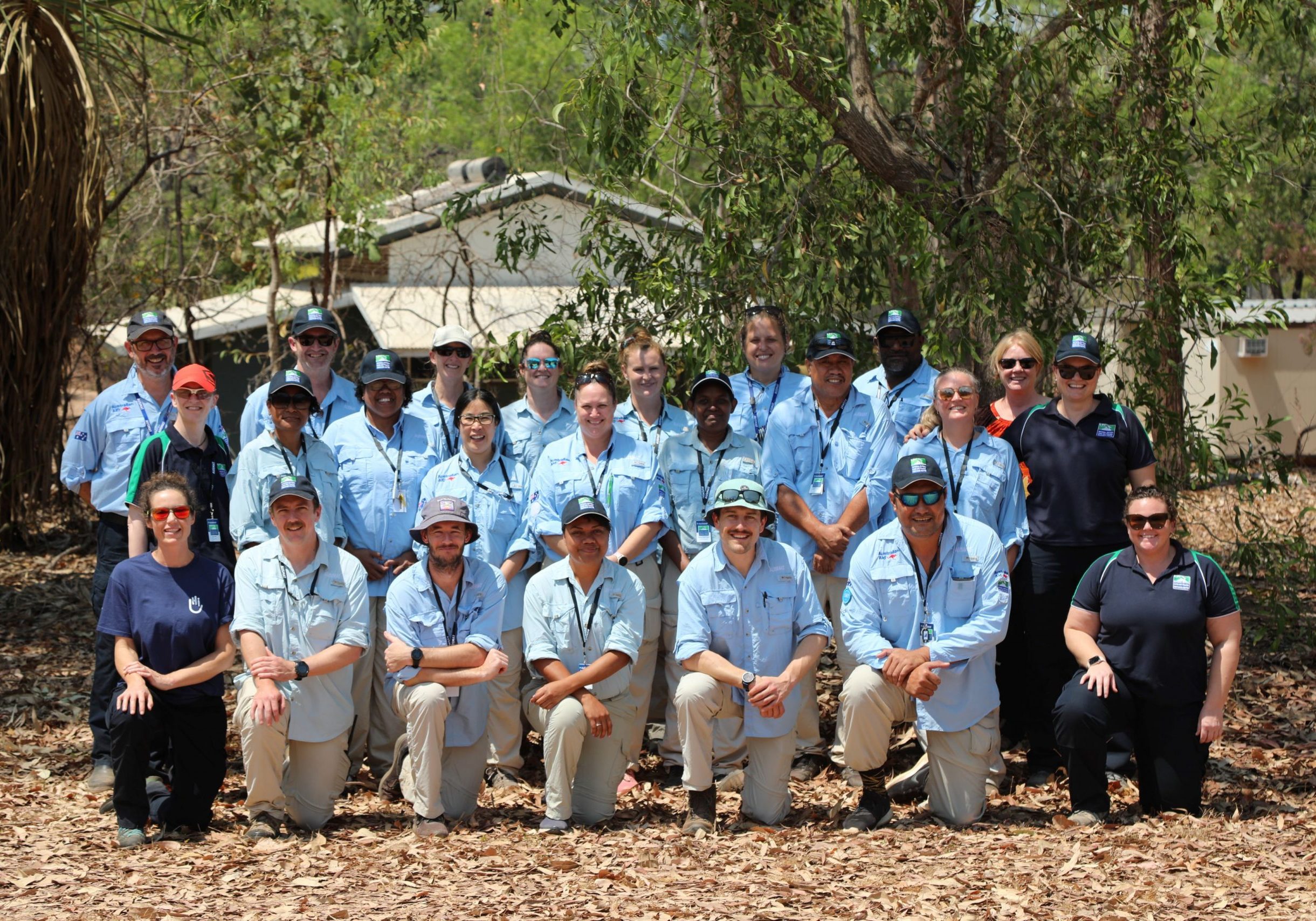 Participants and Faculty from the AUSMAT Rehabilitation Team Member Course standing together and smiling for a team photograph