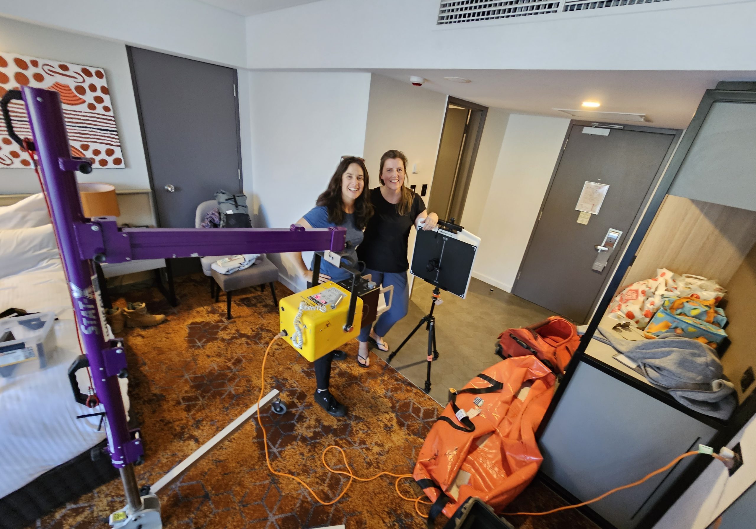 Michelle Brigham And Misha Richards Preparing Xray Machine For Screenings Juno Eadie